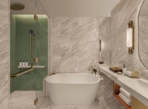 a bathroom with a bath tub and a shower at Andaz One Bangkok, by Hyatt in Bangkok