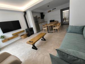 a living room with a couch and a table at Las Casillas de Laujar in Laujar de Andarax