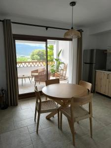 a kitchen and dining room with a table and chairs at Las Casillas de Laujar in Laujar de Andarax