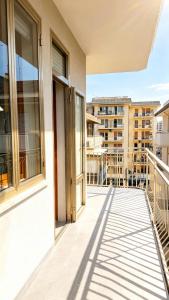 a balcony with a view of a building at Casa Nanà - Sottomarina in Chioggia