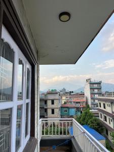 a balcony with a view of the city at Lakecity Apartment in Pokhara