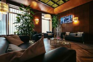 a living room with a couch and a table at Hotel Italia in Turin