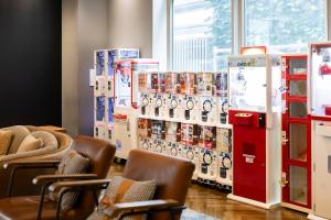 a room with chairs and refrigerators in a store at KOKO HOTEL Sapporo Susukino 2ⁿᵈ in Sapporo
