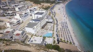 an aerial view of a beach with buildings and the ocean at Villa 4 - Drymades - Thymus Residence in Dhërmi