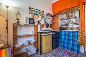 a small kitchen with a sink and a stove at Casa Pantha in Vélez-Málaga