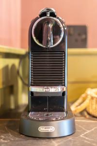 a black and silver appliance sitting on a counter at The Linen Rooms in Knutsford