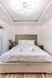 a bedroom with a large bed with a ceiling at Villa Aura Vir in Vir +95 photos