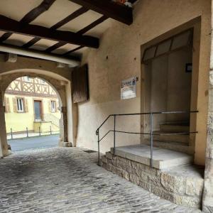 an entrance to a building with a door and stairs at Ankerplatz in Münnerstadt