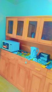 a wooden counter top with acomputer on top of it at Nasau Holiday Apartment in Sigatoka +4 photos