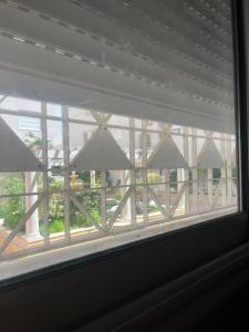 a window with a view of a building at S1 hammamet mrezga in Nabeul