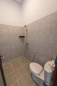 a bathroom with a toilet and a shower at Villa Raksa Canggu in Canggu +18 photos