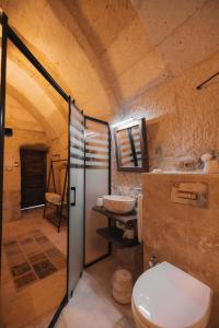 a bathroom with a toilet and a sink at Velum Cappadocia in Göreme +21 photos