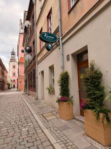 a street with a sign on the side of a building at Kamea in Poznań