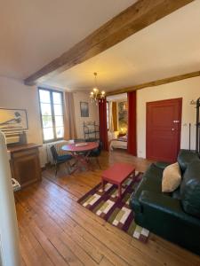 a living room with a couch and a table at Altitude 875 in Arrens-Marsous