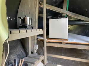 a kitchen with a stove and a refrigerator at Sky Airplane in Tilburg