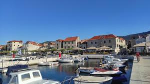 a bunch of boats are docked in a harbor at Apartman Iva in Kaštela