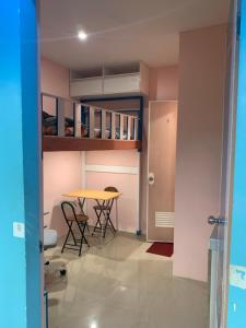 a room with a table and some chairs and a table at Kenjie Apartment in Cordova