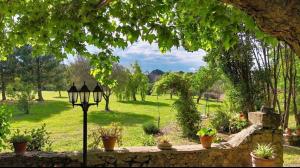 a view of a park with a street light at Douce escapade in Bourg-Saint-Andéol