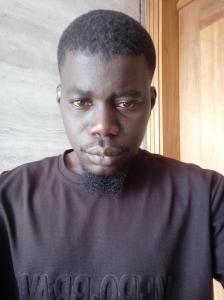 a man wearing a black shirt with a mustache at Mamadou bathily in Dakar