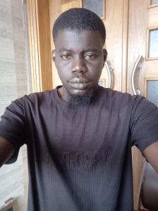 a man wearing a black shirt with a beard at Mamadou bathily in Dakar