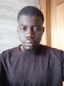 a man wearing a black shirt with a beard at Mamadou bathily in Dakar