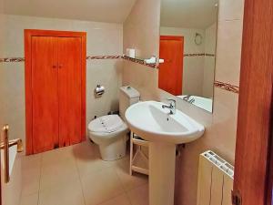 a bathroom with a white sink and a toilet at Apartamentos Pantebre 3000 in Pas de la Casa +63 photos