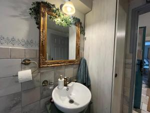 a bathroom with a sink and a mirror at Magnolia Nest in Belgrade +24 photos