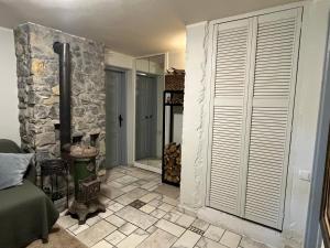 a room with a stone wall and a room with a window at Magnolia Nest in Belgrade