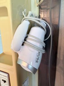 a white light hanging from a door at KUMANOYASAI BASE in Chikatsuyu in Chikatsuyu +35 photos