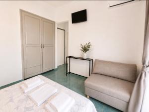 a living room with a couch and a table at Hotel Prinos in Skala Prinou