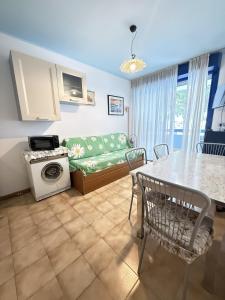 a living room with a couch and a table at Condominio Vera Cruz in Bibione