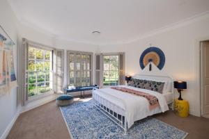 a white bedroom with a large bed and windows at Wayside Zenhill Retreat Bowral Event & Farm in Glenquarry +127 photos