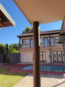 a view of a house with a swimming pool at Urban Rest Guesthouse in Mahikeng