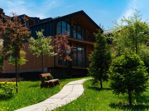 a building with a bench in front of it at Phoenix Relax Park in Bukovel