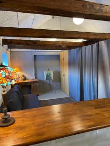 a living room with a couch and a table at Gæstehuset in Tarm +4 photos