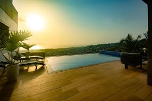 a view of a swimming pool on a building at Elegant Hillside Ocean Stay in Freetown