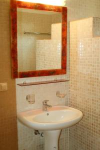 a bathroom with a sink and a mirror at Metochi Villas in Spílion +51 photos