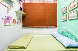 a bed in a room with a window at 1137 Hostel in Bangkok +16 photos