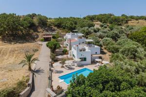 an aerial view of a villa with a swimming pool at Metochi Villas in Spílion