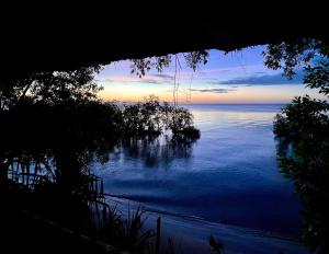 a view of the ocean at sunset at Kitu Kiblu in Kilindoni
