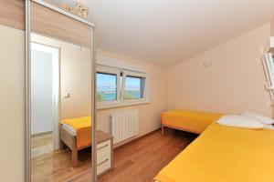 Postel nebo postele na pokoji v ubytování Apartments Dominique