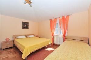 Postel nebo postele na pokoji v ubytování Apartments Dominique