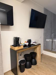 a kitchen with a counter with stools under it at Dimora Fioravante in Vasto