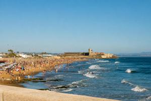 a large group of people on a beach at Kampaoh Playa de Levante in Benidorm