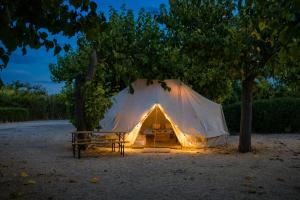 a tent with lights in the middle of a field at Kampaoh Playa de Levante in Benidorm +41 photos