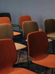 a group of chairs sitting in a room at Beau-Rivage Nyon in Nyon