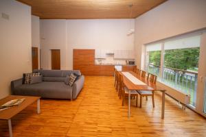 a living room with a couch and a table at Zawoja1560 Apartamenty przy Aptece in Zawoja