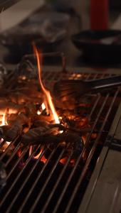 a bunch of food cooking on a grill at The Suite by Ceilao Villas in Ahangama