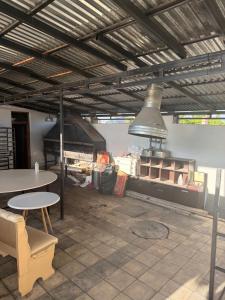 a room with a kitchen with a table and a stove at Events house With Swimming Pool in Agarak