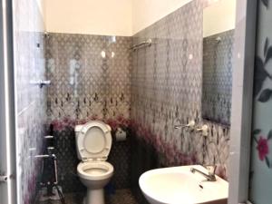 a bathroom with a toilet and a sink at The Mulberry Villa kandy in Kandy